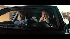 Mel Gibson and Vince Vaughn eating in the car
